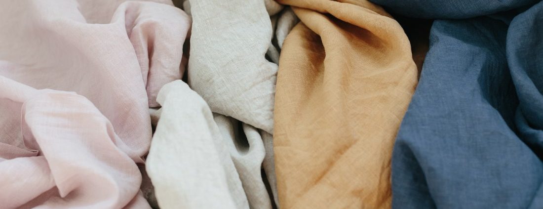 Linen cloth in an array of pale earth tones.