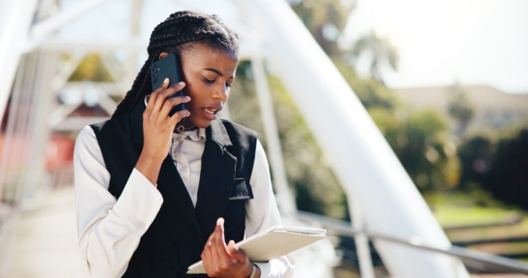 An event planner makes a phone call during a busy, multi-day event.